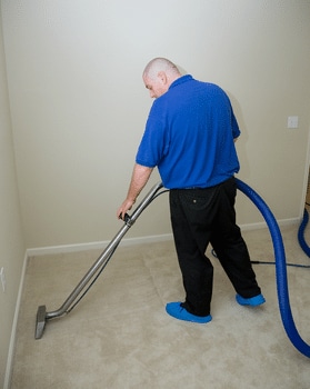 Man Cleaning Carpet in Ellicott City